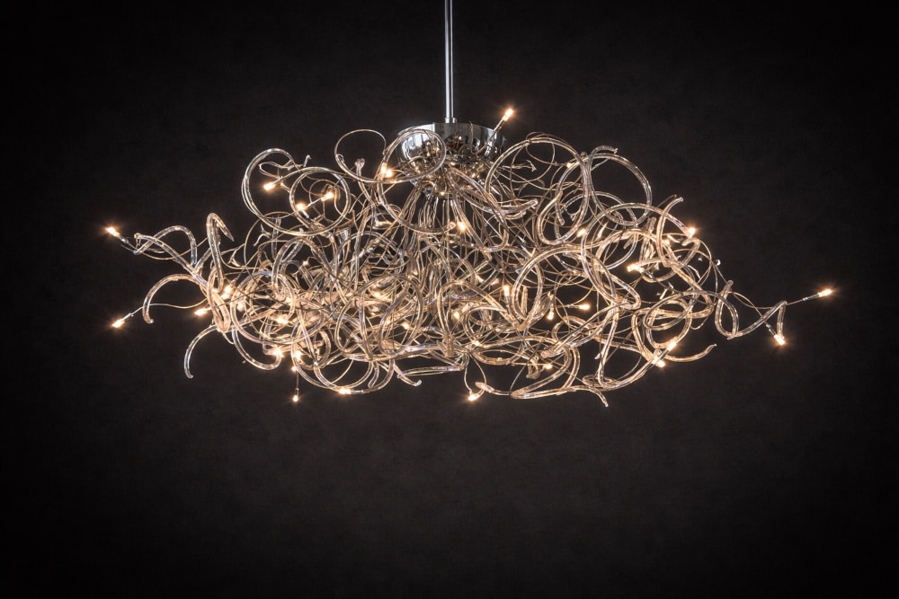 Detail of Energia Clara Wide Body chandelier showing hand-formed metal tendrils and integrated LED light points